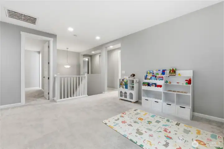 Upstairs is a HUGE loft with SO much space that you could add an office or 5th bedroom!