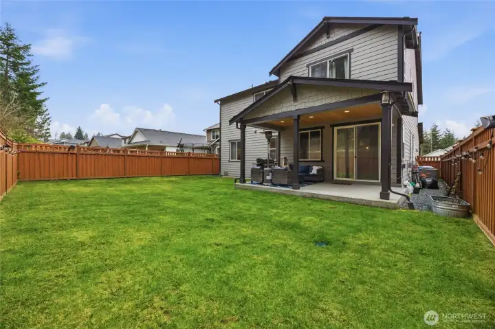 Huge, fully fenced yard with covered patio