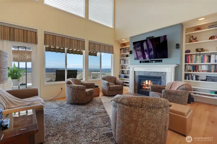 Great Room with deck access and sweeping views. Automatic Blinds included!