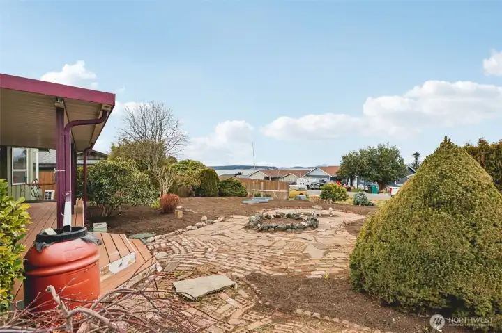 Rain barrel catchment system off the covered front porch with views of beautiful Port Susan.