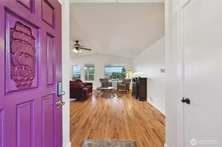 Front entry from the driveway opening into the living room.