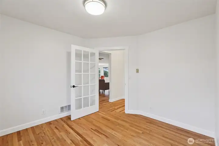 View looking out towards the hall from the den.