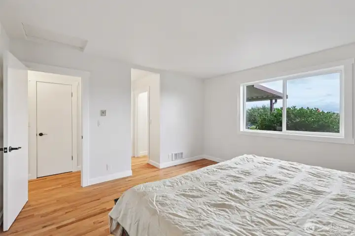 Primary bedroom with en-suite bathroom and spacious closet.