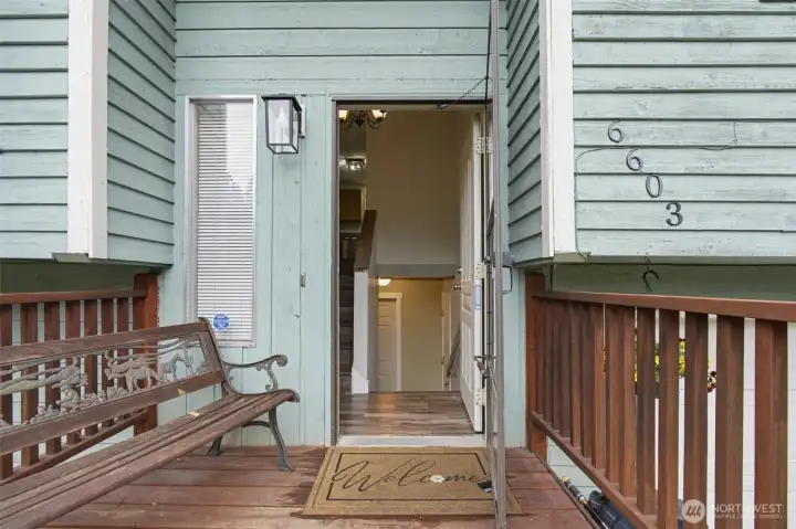 Front deck is large enough to sit outside on a bench and enjoy the surrounding views. As you enter the front door you have the split entry, which is so convenient to entry upstairs for main floor living or the lower lever.