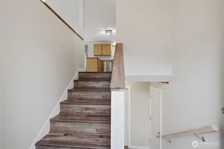 Enter the front door & have easy access to upper main floor, or lower floor for reck room, bathroom and utility room.