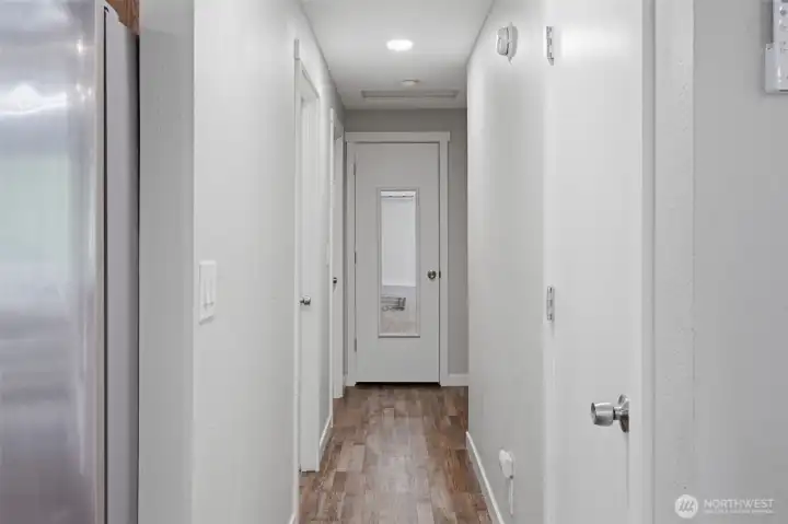 Just pass the kitchen is the hall way to the main floor bathroom and 3 bedrooms.