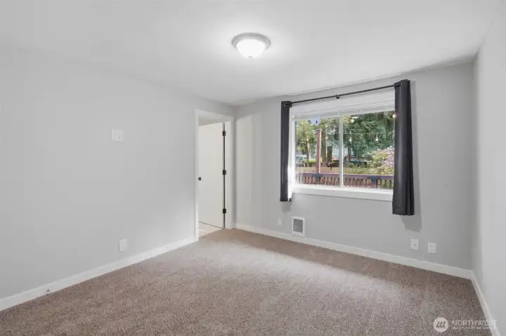 Another view of primary bedroom. Please notice the brand new carpet.