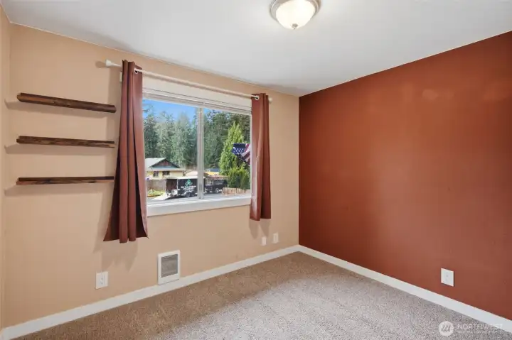 Bedroom #2 has new carpet and a large window for extra natural light.