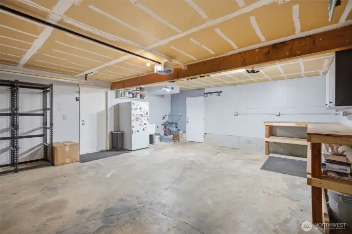 Another view of the oversized garage, completely sheet rocked & lots of space.