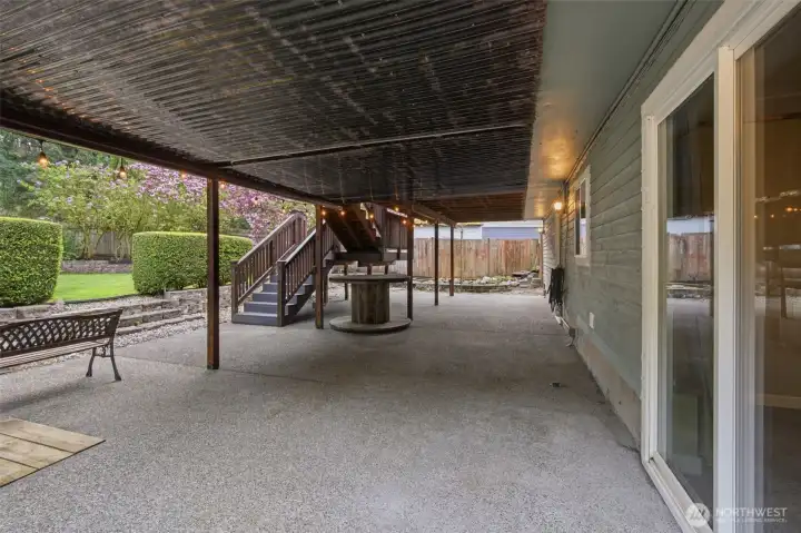 Sliding glass door just outside the lower level reck room. You can enjoy time outside even in raining weather with the this patio.