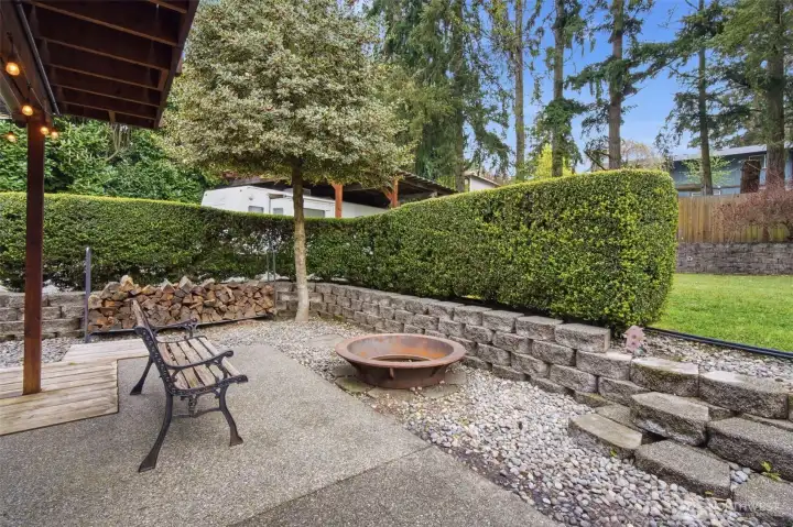 Just to the right of the covered lower level patio you can enjoy a fire pit on those lovely evenings.