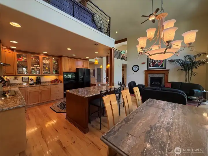 Stunning kitchen with slab granite countertops, gorgeous cabinetry and beautiful lighting throughout!