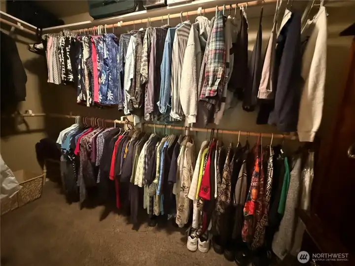 Large walk-in closet in primary suite.