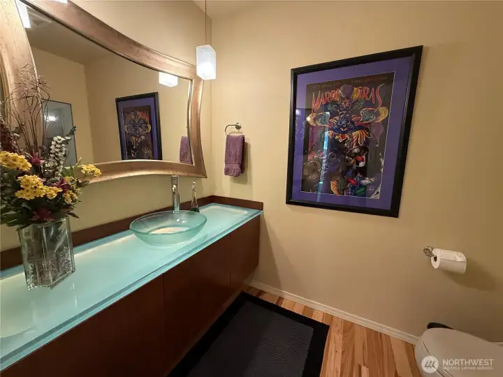 1/2 bath on main level w/ lighted countertop.