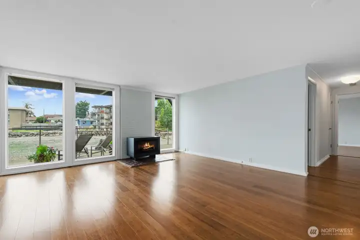 The living room has a wall of windows to capture the natural light and views.
