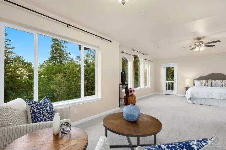 Primary suite with large sitting area, attached 5-piece bath, walk-in closet & private patio.