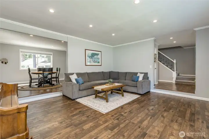 Spacious living room and adjacent dining room, perfect for entertaining Spacious living room and adjacent dining room, perfect for entertaining