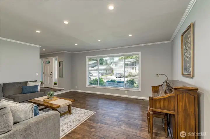 Living room features crown moulding and a huge picture window overlooking the front yard Living room features crown moulding and a huge picture window overlooking the front yard