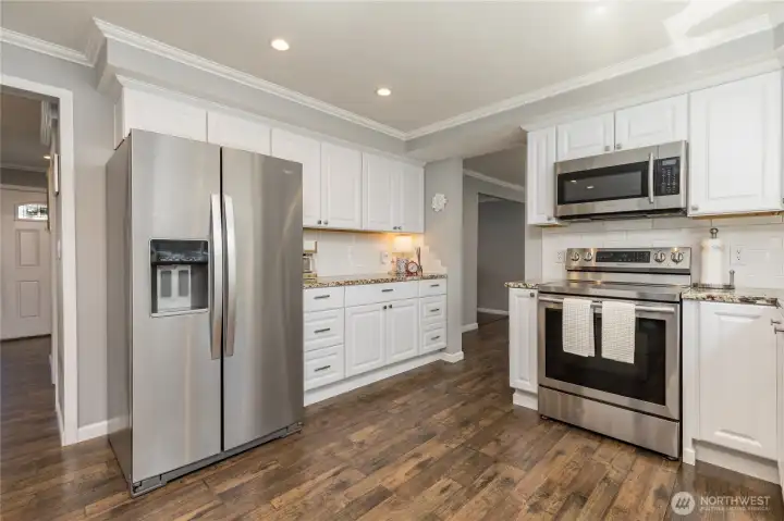 Central kitchen provides easy accessibility to all living areas Central kitchen provides easy accessibility to all living areas