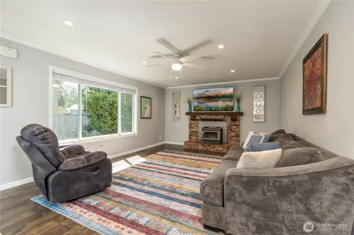 Cozy family room with picture window overlooking the back yard Cozy family room with picture window overlooking the back yard