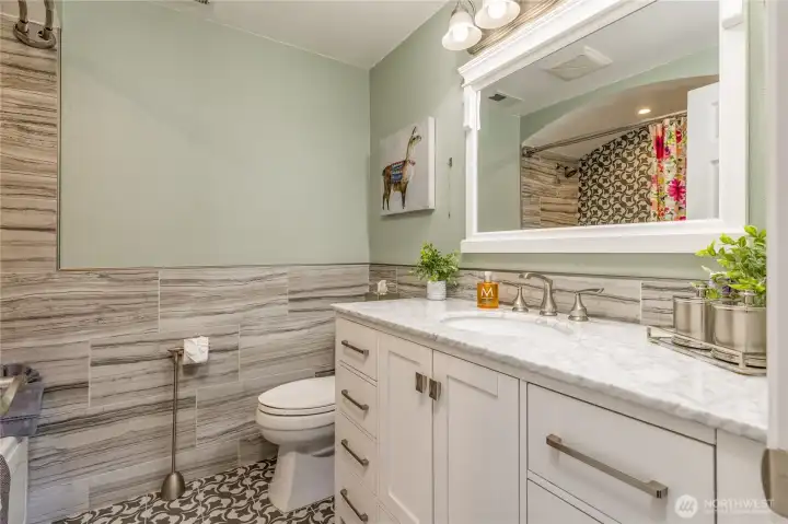 Full hall bathroom upstairs with custom tile and jetted tub Full hall bathroom upstairs with custom tile and jetted tub