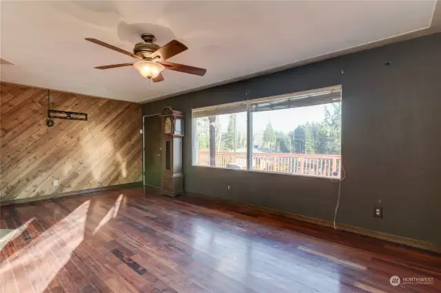 Note the ceiling fan and decorative wood wall.