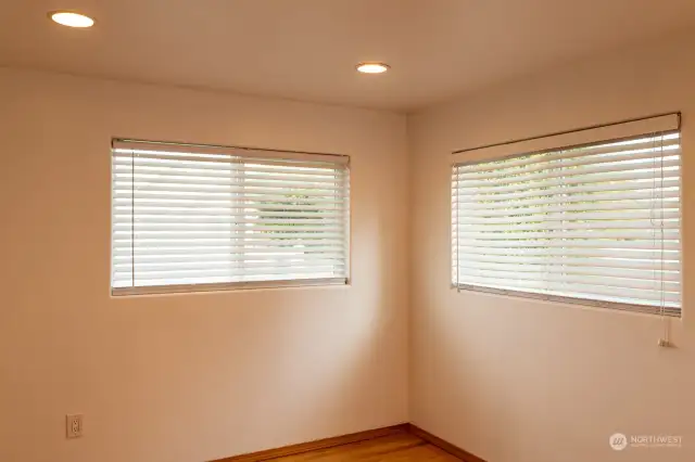 Bedroom with natural light from windows.