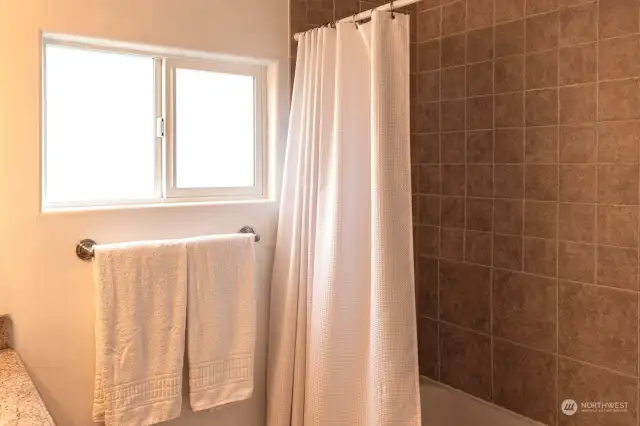 Bathroom with shower/tub tile surround