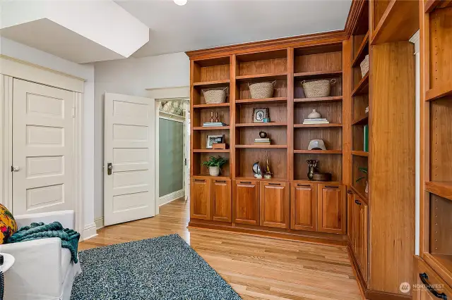 Custom built-in bookcases and storage in the main floor den