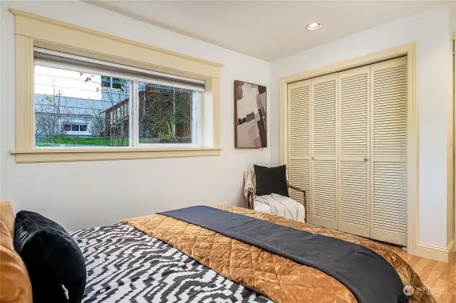 Large windows and closet in the same bedroom