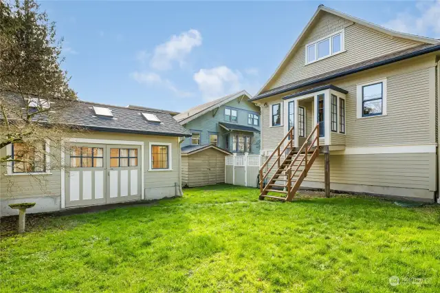 Backyard showing rear of home and studio