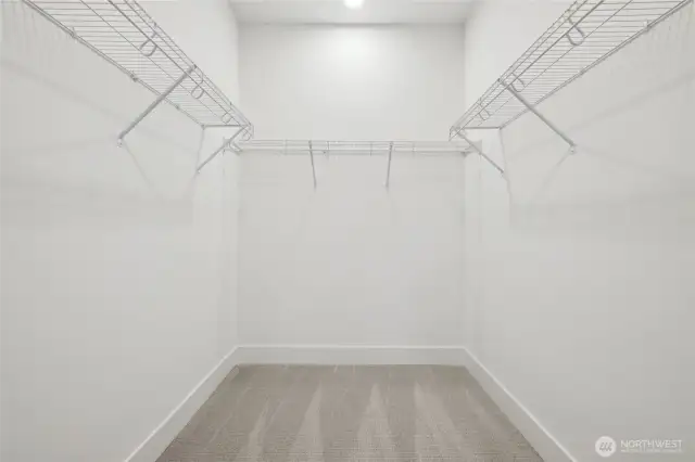 Spacious primary closet. Features and finishes may vary. For marketing use only