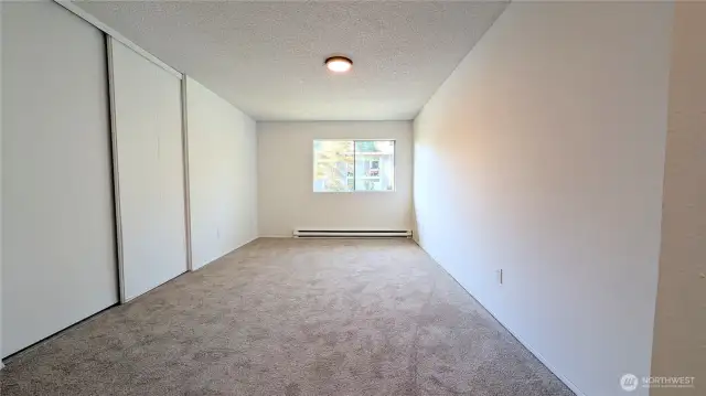 View of Primary Bedroom leaving ensuite hallway- Lots of closet space.