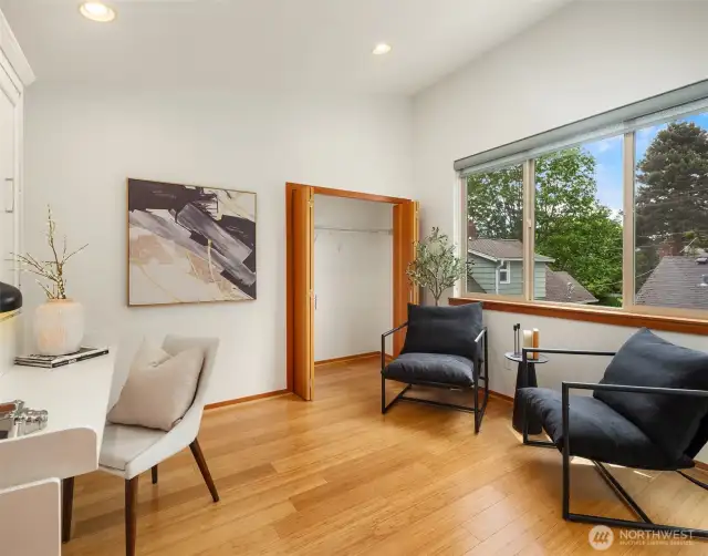 Bedroom 1, staged as an office features built in Murphy Bed.