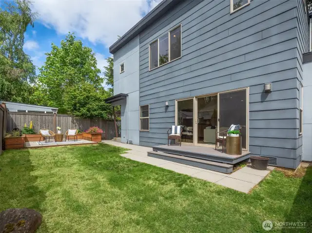 Private backyard with patio and deck with plenty of space to play.
