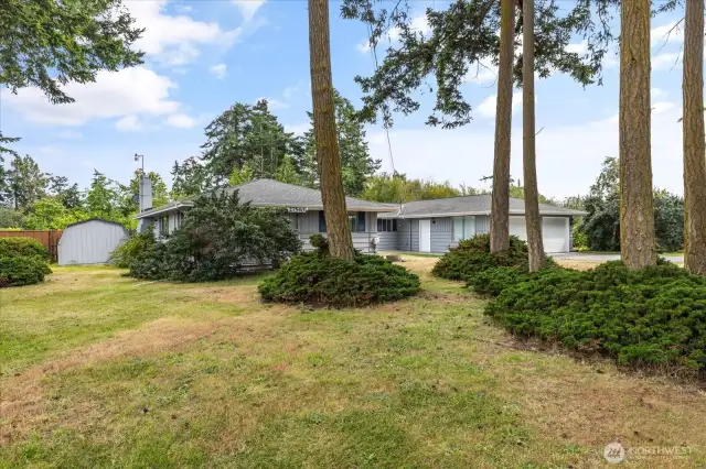 Tucked neatly on over an acre, this home delivers big time!