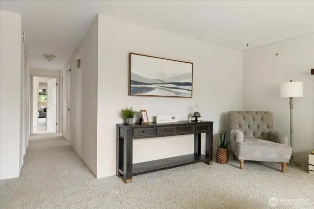 Down the hall, you have three bedrooms and 1 3/4 baths.
