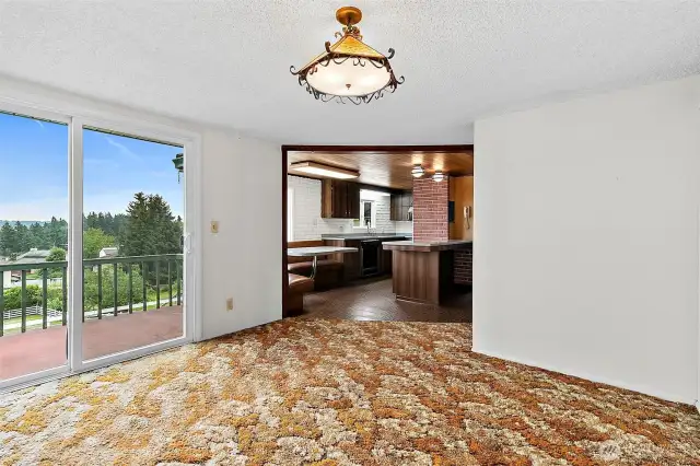 14x10 Dinning room with a slider to an upper deck.