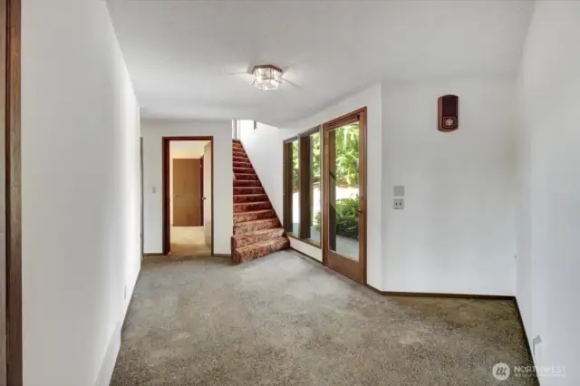 Beautiful exposed polished aggregate entry. Interior stairs up to the MIL.