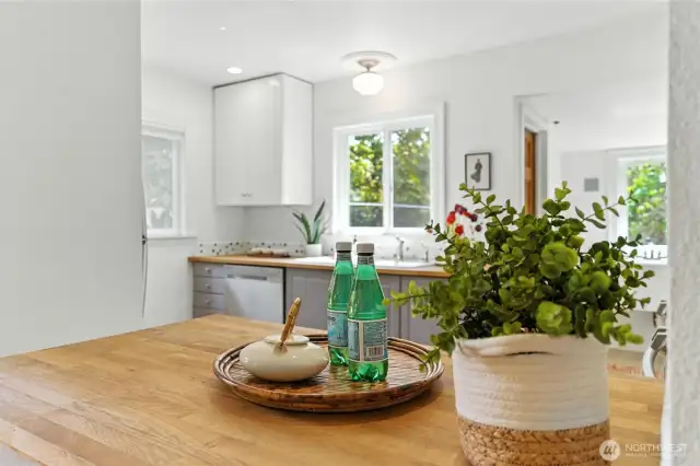 Butcher block counters in this bright kitchen!