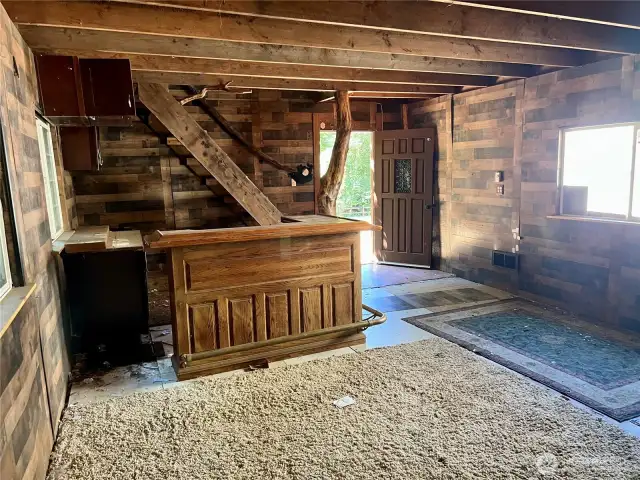 Inside 'cave' with bar and wood stove off to right (just outside of picture)