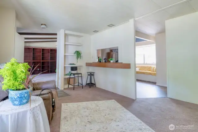 Convenient breakfast bar that creates connection and built-in display/shelving.