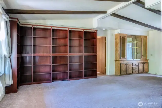 Bonus rm w/abundant shelving ~ perfect for your library or treasured collections. Railing added for practicality.  *Notice how the vaulted ceiling lifts the room, amplifying its openness.