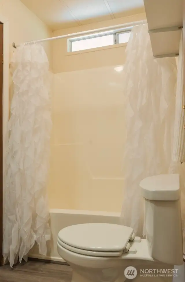 2nd full bath ~ easy access from back deck and 2nd/3rd bedrooms.