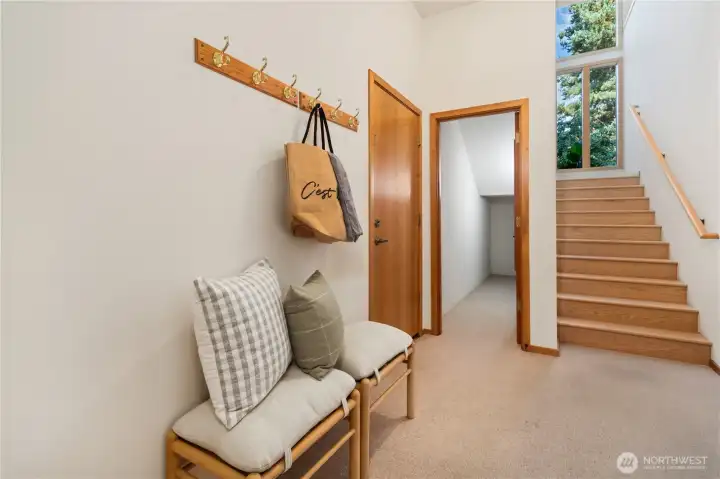 Downstairs w/ ample storage & door to attached 1 car garage.