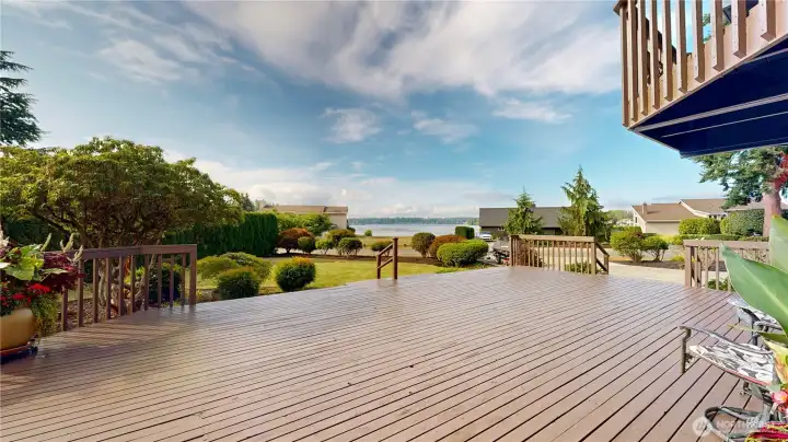 Expansive deck with beautiful lake views—perfect for entertaining, relaxing, or enjoying the outdoors.