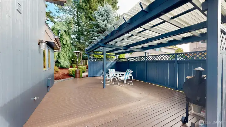 Covered deck with ample space for outdoor dining, barbecues, and year-round entertaining.
