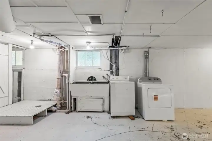 Laundry and plumbing for 1/2 bath downstairs.