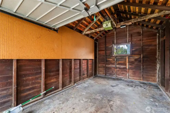 The interior of the garage is ready for your car, lawn care items, or storage.