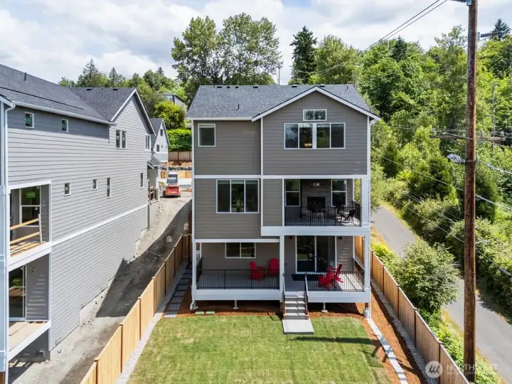 Three levels of flexible living, that backs to protected green space! (older photo-this community is 100% complete)
